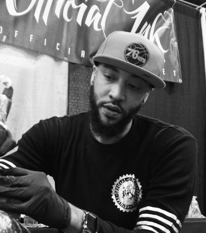 Tattoo artist working with FYT tattoo supplies at a New York tattoo studio